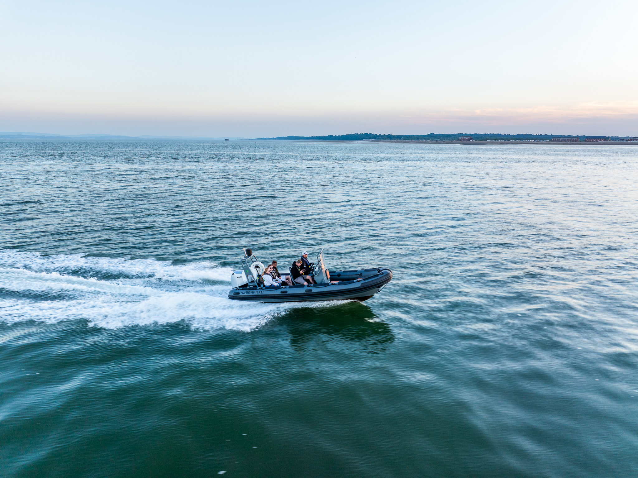 RIB boat cruising at sunset on The Solent